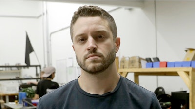 In this Aug. 1, 2018, file photo, Cody Wilson holds a 3D-printed gun at his shop, in Austin, Texas.