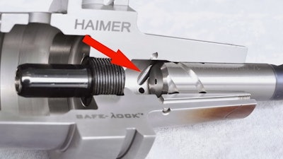 Cut away Safe-Lock-holder for shrinking technology. The drive key, which can be seen at the bottom of the shank of the tool holder, grips into the groove in the tool shank ultimately providing form locking in combination with the high accuracy frictional clamping of shrink fit tool holders.