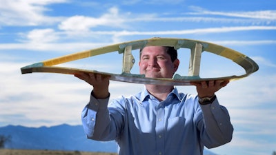 Todd Griffith shows a cross-section of a 50-meter blade, which is part of the pathway to the 200-meter exascale turbines being planned under a DOE ARPA-E-funded program.
