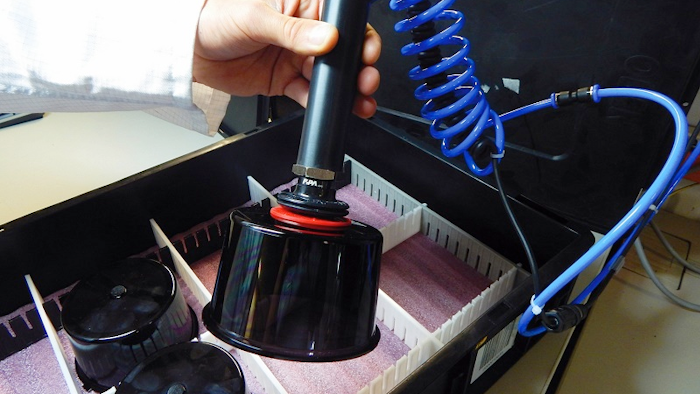 The custom hand gripper enables the effective visual inspection of the plastic caps, which must remain free of all defects and contaminants during the production and quality testing procedures, and thus cannot be handled manually.