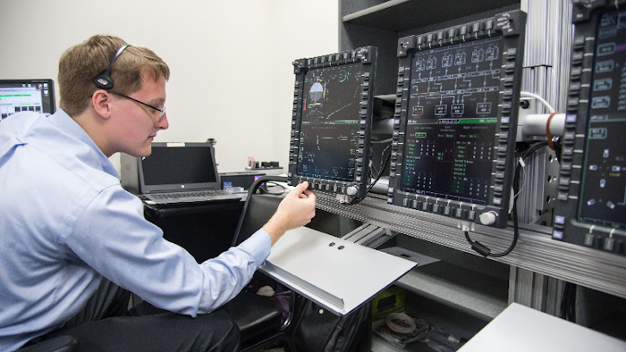 An engineer evaluates Orion’s display and control system.