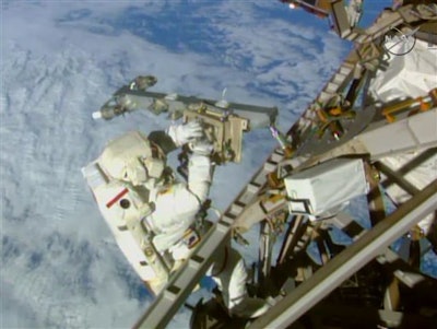 In this Sunday, March 1, 2015 image made from video provided by NASA, astronaut Terry Virts installs an antenna and boom during a spacewalk outside the International Space Station. On Friday, Feb. 19, 2016, NASA announced it received a record number of applicants _ some 18,300 _ for its next astronaut class. That’s more than double the previous record of 8,000 for the first space shuttle astronaut class in 1978.