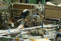 The 3D printed part, a black bracket holding the instrument's fiber-optic cables, is visible in the back of the ATLAS instrument.