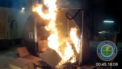 This file frame grab from video, provided by the Federal Aviation Administration (FAA) shows a test at the FAAs technical center in Atlantic City, N.J., in April 2014, where a cargo container was packed with 5,000 rechargeable lithium-ion batteries. A U.N. aviation agency has voted to ban cargo shipments of rechargeable lithium batteries on passenger planes because they can create intense fires capable of destroying the aircraft. The Feb. 22, 2016, decision by International Civil Aviation Organization's top-level governing council isn't binding, but most countries follow the agency's standards. The ban goes into effect on April 1.