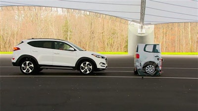 In this frame grab from video provided by the Insurance Institute for Highway Safety (IIHS), taken in 2015, a vehicle closes in on a Strikeable Surrogate Vehicle (SSV) at the IIHS Vehicle Research Center in Ruckersville, Va. Federal regulators and the auto industry are taking a more lenient approach than safety advocates would like to phasing in automatic braking systems for passenger cars, according to the official records of their closed-door negotiations. Systems that automatically apply brakes to prevent or mitigate collisions, rather than waiting for the driver to act, are the most important safety technology available today that’s not already required in cars.
