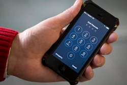 An iPhone is seen in Washington, Wednesday, Feb. 17, 2016. The San Bernardino County-owned iPhone at the center of an unfolding high-profile legal battle between Apple Inc. and the U.S. government lacked a device management feature bought by the county that, if installed, would have allowed investigators easy and immediate access.