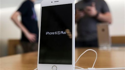 An Apple iPhone 6s Plus smartphone is displayed Friday, Sept. 25, 2015 at the Apple store at The Grove in Los Angeles. On Wednesday, Feb. 17, 2016, a federal judge ordered Apple Inc. to help the FBI hack into an encrypted iPhone used by Syed Farook, who along with his wife, Tashfeen Malik, killed 14 people in December in the worst terror attack on U.S. soil since Sept. 11, 2001. Apple has helped the government before in this and previous cases, but this time Apple CEO Tim Cook said no and Apple is appealing the order.