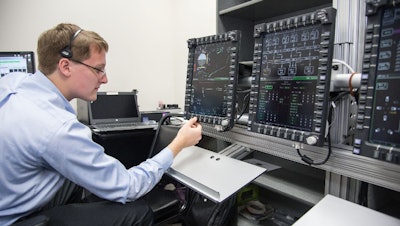 An engineer evaluates Orion’s display and control system.