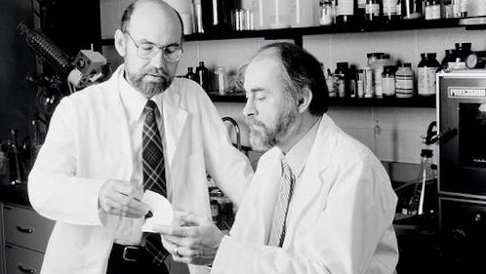 This undated photo shows Spencer Silver, left and Art Fry, right, holding a Post-It Note pad. Alan Amron, an inventor with 40 patents, claims that he invented what he called the Press-On Memo in 1973, a year before Fry and Silver, 3M scientists, developed what later became known as the Post-It Note. Amron is suing 3M for $400 million in damages.