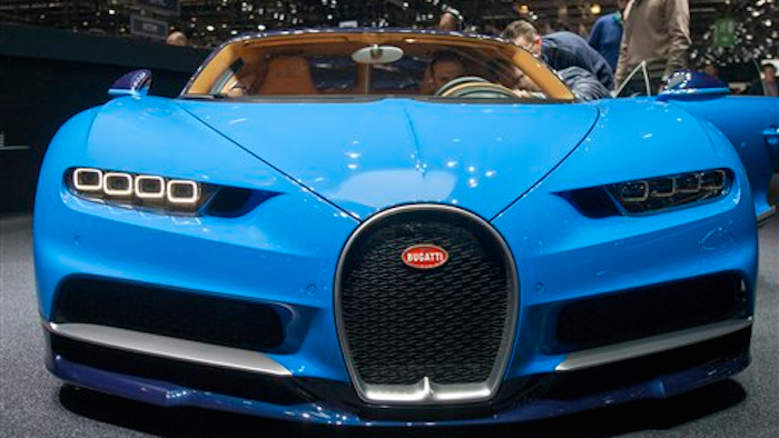 The New Bugatti Chiron is presented during the press day at the 86th International Motor Show in Geneva, Switzerland, Tuesday, March 1, 2016. The Motor Show will open its gates to the public from March 3 to 13, presenting more than 200 exhibitors and more than 120 world and European premieres.