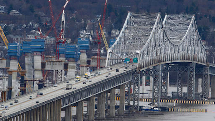 In this March 15, 2016, photo, construction continues on the Tappan Zee Bridge as seen from Nyack, N.Y. New York lawmakers are considering a budget proposal from Gov. Andrew Cuomo to devote $1 billion in financial settlement money to help the authority pay for a budget-busting replacement for the Tappan Zee Bridge while keeping tolls down.