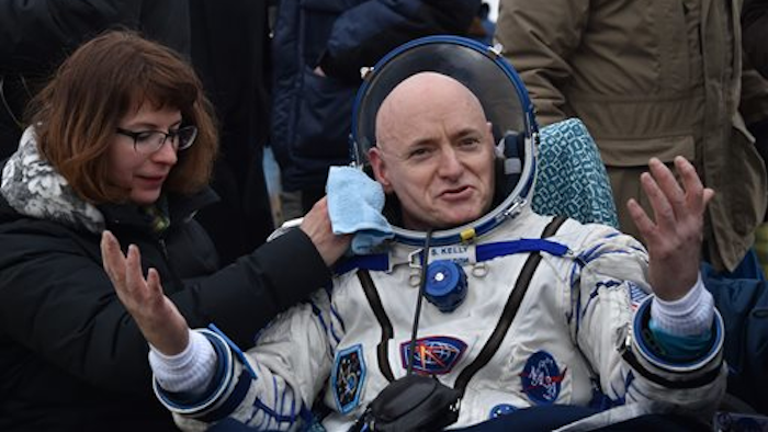 Scott Kellyreacts after landing near the town of Dzhezkazgan, Kazakhstan, on Wednesday, March 2, 2016.