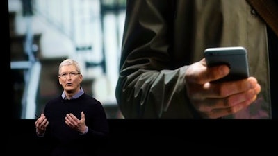 Apple CEO Tim Cook, speaks at an event to announce new products at Apple headquarters Monday, March 21, 2016, in Cupertino, Calif.