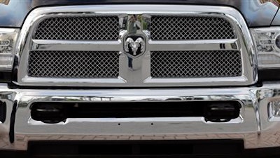 This Wednesday, Nov. 4, 2015, photo, shows the front of a 2016 Dodge Ram 3500 Heavy Duty pickup at a Fiat Chrysler dealership in Doral, Fla. Industry analysts expect February sales to bounce back after a slight decline in January. All automakers report their monthly sales figures on Tuesday, March 1, 2016.