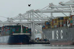 In this Thursday, March 3, 2016 photo, container ships are moored to docks at the Port of Oakland in Oakland, Calif. On Thursday, March 17, 2016, the Commerce Department reports on the U.S. current account trade deficit for the 2015 October-December quarter.