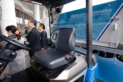 A Toyota fuel cell forklift, front, and a hydrogen fueling station and carrying hydrogen, background, are displayed in Yokohama, near Tokyo, after a press event for Hydrogen Supply Chain Demonstration Project Monday, March 14, 2016.