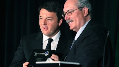 Italy's Prime Minister Matteo Renzi, left, receives the keys to the city from Fallon Mayor Ken Tedford during an inauguration ceremony of Enel Green Power North America Inc.'s Stillwater Geothermal Plant near Fallon, Nev., on Tuesday, March 29, 2016. The facility is the only geothermal power plant in the world that combines geothermal energy with two kinds of solar technology.