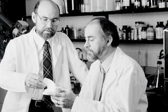 This undated photo shows Spencer Silver, left and Art Fry, right, holding a Post-It Note pad. Alan Amron, an inventor with 40 patents, claims that he invented what he called the Press-On Memo in 1973, a year before Fry and Silver, 3M scientists, developed what later became known as the Post-It Note. Amron is suing 3M for $400 million in damages.