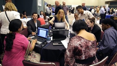 In this Sept. 10, 2014 file photo, job seekers create resumes at the NJ Department of Labor's resume clinic in the Atlantic City Convention Center in Atlantic City, N.J. Ten U.S. states still have not regained all the jobs they lost in the Great Recession, even after six and a half years of recovery, while many more have seen only modest gains. New Jersey has nearly 1 percent fewer jobs than it did at the end of 2007, and Missouri is just below its pre-recession level.