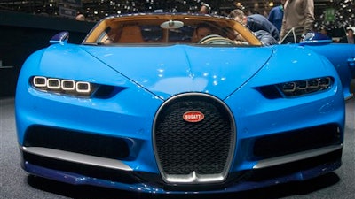 The New Bugatti Chiron is presented during the press day at the 86th International Motor Show in Geneva, Switzerland, Tuesday, March 1, 2016. The Motor Show will open its gates to the public from March 3 to 13, presenting more than 200 exhibitors and more than 120 world and European premieres.