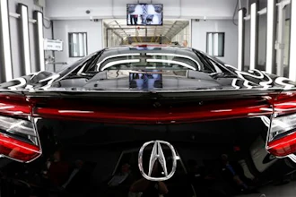 In this Wednesday, March 9, 2016, photo, the NSX, Acura's next-generation supercar, sits in the final inspection room in Acura's new Performance Manufacturing Center in Marysville, Ohio.