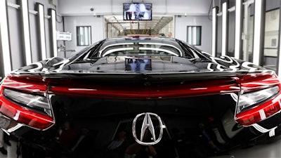 In this Wednesday, March 9, 2016, photo, the NSX, Acura's next-generation supercar, sits in the final inspection room in Acura's new Performance Manufacturing Center in Marysville, Ohio.