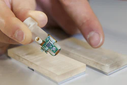 Detail of the bionic fingertip electronics that restored sensations of texture to amputee Dennis Aabo Sørensen, and the plastic gratings with rough and smooth textures.