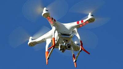 A close-up look at a drone flying over Ladhope Recreation Ground.