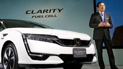 Honda Motor Co. President and Chief Executive Takahiro Hachigo speaks during a press conference in the media preview of the Clarity Fuel Cell at the automaker's headquarters in Tokyo, Thursday, March 10, 2016. Honda has rolled out a new fuel cell vehicle, the first of its kind to be a five-seater. The zero-emissions Clarity may not sell in big numbers, however, given its price tag of 7.66 million yen ($67,000).