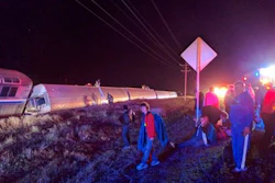 Passengers gather after a train derailed near Dodge City, Kan., Monday, March 14, 2016. An Amtrak statement says the train was traveling from Los Angeles to Chicago early Monday when it derailed just after midnight.