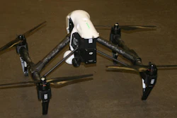 Robotic quadcopter autonomously mounts and de-mounts a network of video cameras to building elements on the site to record dynamic construction operations from strategic locations and viewpoints.
