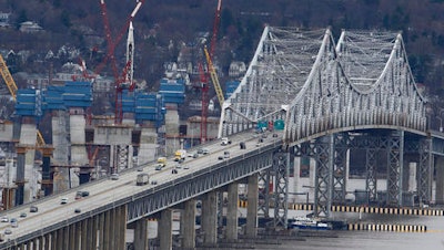 In this March 15, 2016, photo, construction continues on the Tappan Zee Bridge as seen from Nyack, N.Y. New York lawmakers are considering a budget proposal from Gov. Andrew Cuomo to devote $1 billion in financial settlement money to help the authority pay for a budget-busting replacement for the Tappan Zee Bridge while keeping tolls down.