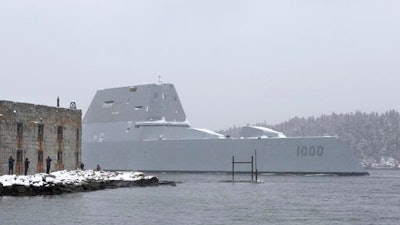 The USS Zumwalt, the Navy's new guided missile destroyer, passes Fort Popham at the mouth of the Kennebec River, as it heads out to sea, Monday, March 21, 2016, in Phippsburg, Maine. The new destroyer, which was built at Bath Iron Works, will undergo final builder trials before the ship is presented to the Navy for inspection.