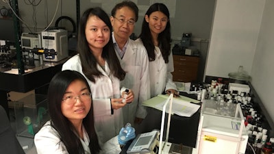 Dr. Shin-Tson Wu and doctoral students work on new liquid crystal mixtures in his lab at the University of Central Florida's College of Optics & Photonics. From left, Fenglin Peng, Yuge 'Esther' Huang, Wu and Fangwang 'Grace' Gou.