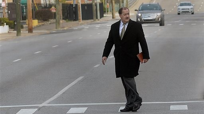 Former Massey Energy CEO Don Blankenship makes his way across Virginia Street in Charleston, W.V., before entering the Robert C. Byrd Federal Courthouse for his sentencing on Wednesday, April 6, 2016. Blankenship faces up to one year in prison and maximum fine of $250,000 for a conviction connected to the deadliest U.S. mine explosion in four decades. Prosecutors also contend he should be held liable for $28 million in restitution to a coal company related to the case.