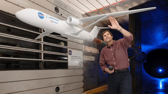 Greg Gatlin, NASA aerospace research engineer from NASA’s Langley Research Center, inspects the truss-braced wing during testing in the Unitary Plan Wind Tunnel complex at NASA’s Ames Research Center in Silicon Valley.