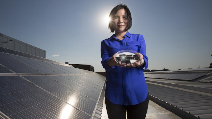 Dr. Xiaojing Hao of UNSW's Australian Centre for Advanced Photovoltaics holding the new CZTS solar cells.