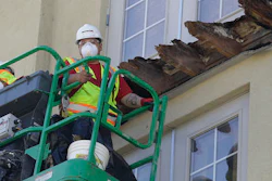 In this June 18, 2015 file photo, a crew works on the remaining wood of an apartment building balcony that collapsed in Berkeley, CA.