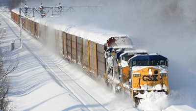 n this Nov. 19, 2014 file photo, a CSX freight train plows its way past the Cemetery Rd. overpass in Lancaster, N.Y CSX railroad plans to continue cutting costs this year to deal with slowing freight volume and declining profits. Executives at the Jacksonville, Fla., based railroad discussed their outlook Wednesday, April 13, 2016, one day after reporting a 19 percent drop in first quarter profit. (AP Photo/Gary Wiepert)