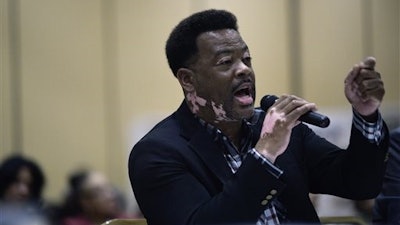 Flint, Mich., resident Quincy Murphy speaks during a hearing held by the Michigan Civil Rights Commission. Half a century after a civil rights panel investigated Flint's segregated housing, the commission held its first hearing Thursday into whether city residents again faced discrimination or racial bias - this time related to the city's crisis over lead-tainted drinking water.