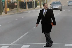 Former Massey Energy CEO Don Blankenship makes his way across Virginia Street in Charleston, W.V., before entering the Robert C. Byrd Federal Courthouse for his sentencing on Wednesday, April 6, 2016. Blankenship faces up to one year in prison and maximum fine of $250,000 for a conviction connected to the deadliest U.S. mine explosion in four decades. Prosecutors also contend he should be held liable for $28 million in restitution to a coal company related to the case.