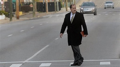 Former Massey Energy CEO Don Blankenship makes his way across Virginia Street in Charleston, W.V., before entering the Robert C. Byrd Federal Courthouse for his sentencing on Wednesday, April 6, 2016. Blankenship faces up to one year in prison and maximum fine of $250,000 for a conviction connected to the deadliest U.S. mine explosion in four decades. Prosecutors also contend he should be held liable for $28 million in restitution to a coal company related to the case.