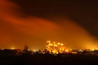 A plume of smoke rises over the State oil company Petroleos Mexicanos' petrochemical plant in Coatzacoalcos, Mexico, Wednesday April 20, 2016. An explosion ripped through a petrochemical plant on the southern coast of the Gulf of Mexico on Wednesday, killing 3 people, injuring dozens and sending flames and a toxin-filled cloud into the air, officials said.