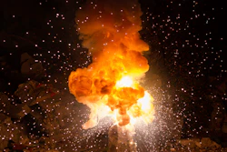 Realistic Fiery Explosion Busting Over A Black Background 000068786059 Medium 5707b1b125003