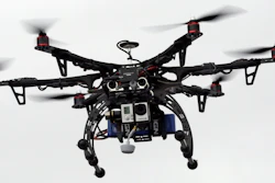 In this file photo, a drone is demonstrated in Brigham City, Utah. A government-sponsored committee is recommending standards that could clear the way for commercial drone flights over populated areas.