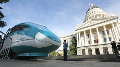 In this Feb. 26, 2015 file photo, a full-scale mock-up of a high-speed train is displayed at the Capitol in Sacramento, Calif. The board that oversees California’s massive high-speed rail project is meeting in Sacramento on Thursday afternoon, April 28, 2016, to consider a new $64 billion business plan. The updated plan calls for a station in Merced and the first stretch to go from the Central Valley to the San Jose area.