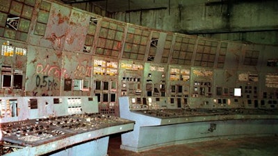In this Nov. 10, 2000, file photo the shattered remains of the control room for Reactor No. 4 at the Chernobyl nuclear power plant, Ukraine. We reached the old control room, long and poorly lighted, with its damaged machinery, the place where the Soviet engineers threw a power switch for a routine test on that doomed night, and two explosions followed. The Chernobyl nuclear power plant explosion was only about 60 miles from photographer Efrem Lukatsky's home, but he didn’t learn about it until the next morning from a neighbor. Only a few photographers were allowed to cover the destroyed reactor and desperate cleanup efforts, and all of them paid for it with their health. I went a few months later, and have returned dozens of times.