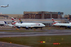 In this 2014 file photo, aircraft wait on the tarmac at Heathrow Airport in London. A collision between a British Airways passenger jet and a drone left the plane undamaged, but the aviation industry shaken. British police and air-accident authorities are investigating the incident.