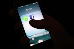 This Feb. 19, 2014, file photo shows the Facebook app icon on an iPhone in New York. A feature rolling out Tuesday, April 5, 2016, on Facebook's iPhone app interprets what's in a photo using a form of artificial intelligence to recognize faces and objects for blind and visually impaired people as they scroll through the pictures posted on the world's largest online social network.