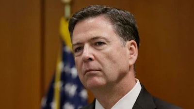 FBI Director James Comey addresses the media after visiting with employees and other law enforcement officials, Tuesday, April 5, 2016, in Detroit.